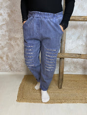 Stretch-housut reilulla mitoituksella, paljettikoristeiset lahkeet, korkea kuminauhavyötärö, taskut, kapeneva lahje