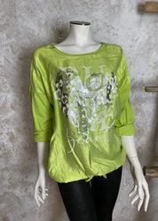 Pitkähihainen paita strassikoristellulla printillä, kevyt etuosa, joustava selkä, laskettu olkalinja ja kiristettävä pussihelma