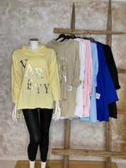 Naisten hupparitunika printillä, pehmeä joustava materiaali, A-linja, pidempi takaa, pitkät hihat ja laskettu olkalinja