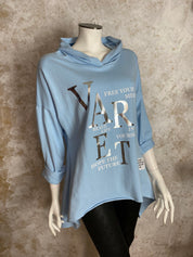 Naisten hupparitunika printillä, pehmeä joustava materiaali, A-linja, pidempi takaa, pitkät hihat ja laskettu olkalinja