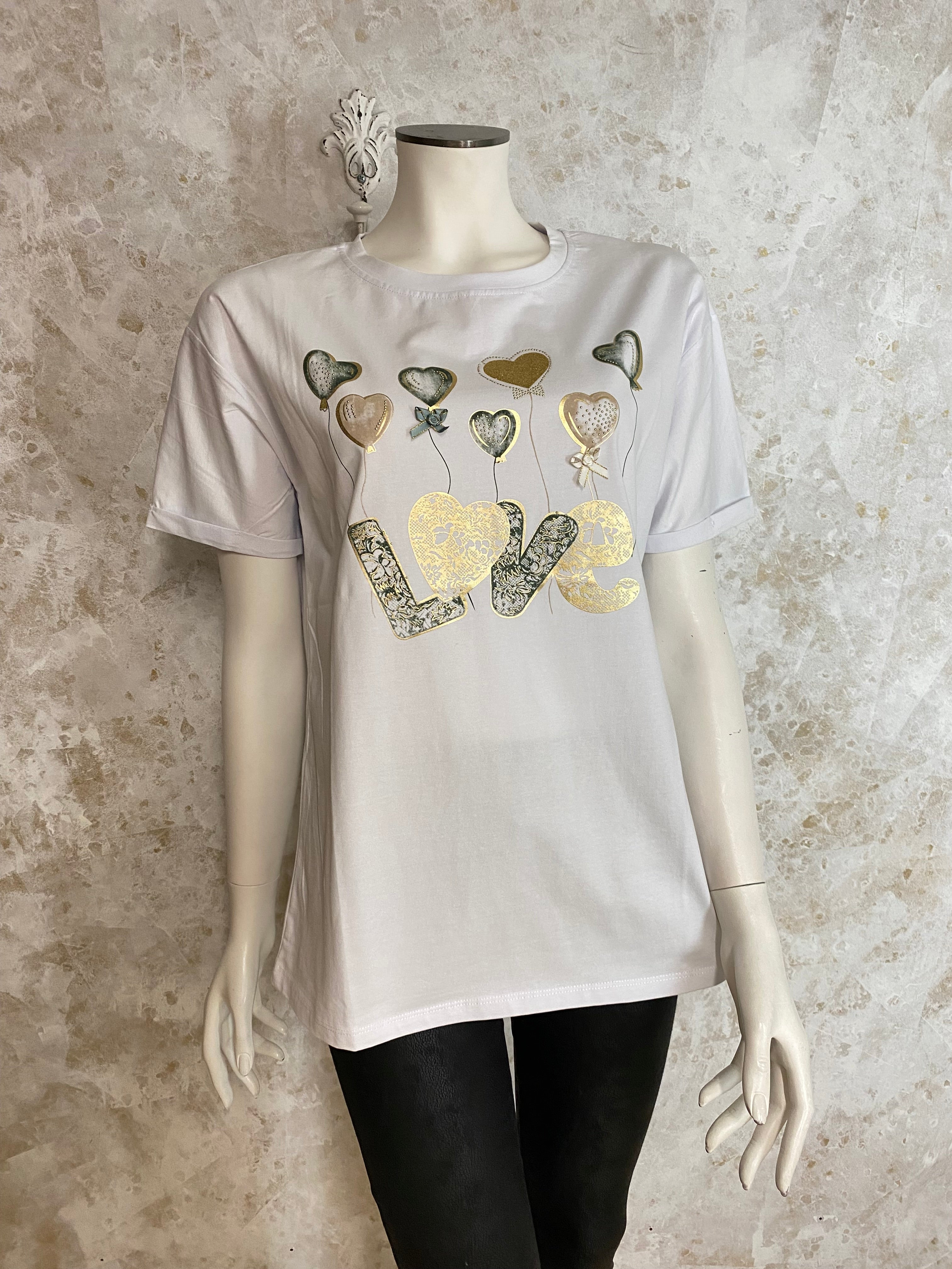 Naisten valkoinen t-paita strassikoristeisella printillä, joustava laadukas materiaali, naisellinen malli, käänteet hihoissa ja O-pääntie