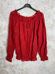 Pellavapusero frillayksityiskohdilla, joustava pääntie, pitkät hihat ja pussimainen helma
