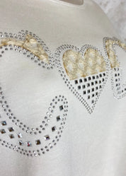 Mukavan pehmeä naisellinen collegepaita strassikoristeella, täyspitkät hihat, halkiot helmassa ja O-pääntie