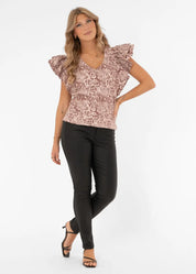 Hurmaava juhlapaita kohoruusukuvioinnilla, lyhyillä kaksikerroksisilla perhoshihansuilla, A-linjainen, V-pääntie ja lyhyet halkiot helmassa