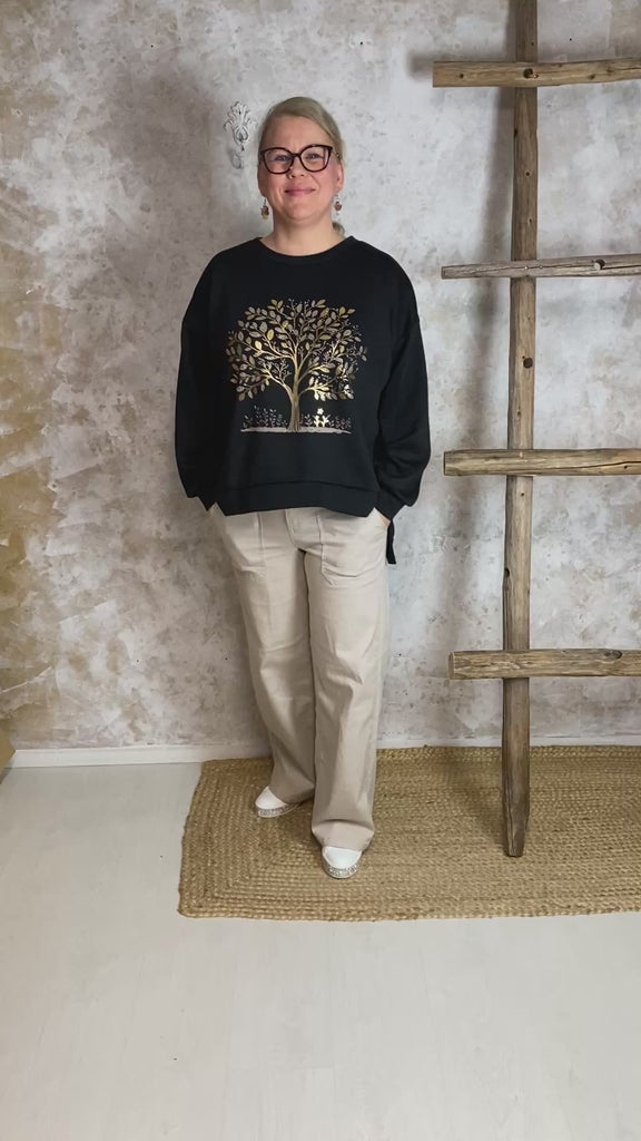 Haalean beiget stretch-housut, leveät lahkeet, korkea vyötärö, edessä vetoketju ja nappi sekä taskut edessä ja takana