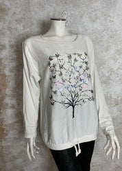 Värikäs elämänpuu-paita, jossa pitkät hihat, kimaltava etukuvio, laskettu olkalinja ja säädettävä helma.