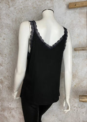 Hihaton toppi naisille, joustava ribbineulos, pitsiyksityiskohdat hihansuissa ja pääntiellä, V-pääntie arkeen ja juhlaan