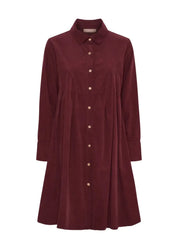 Naisellinen samettipaitamekko napituksella ja kauluksella, leveä helma, laskokset ja taskut – elegantti valinta arkeen ja juhlaan.